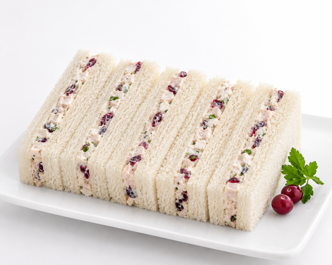 Layered dessert with berries on a white plate